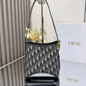 Master quality D Mini Structured Bucket Crossbody Bag with Vintage Metal Charm & Adjustable Strap